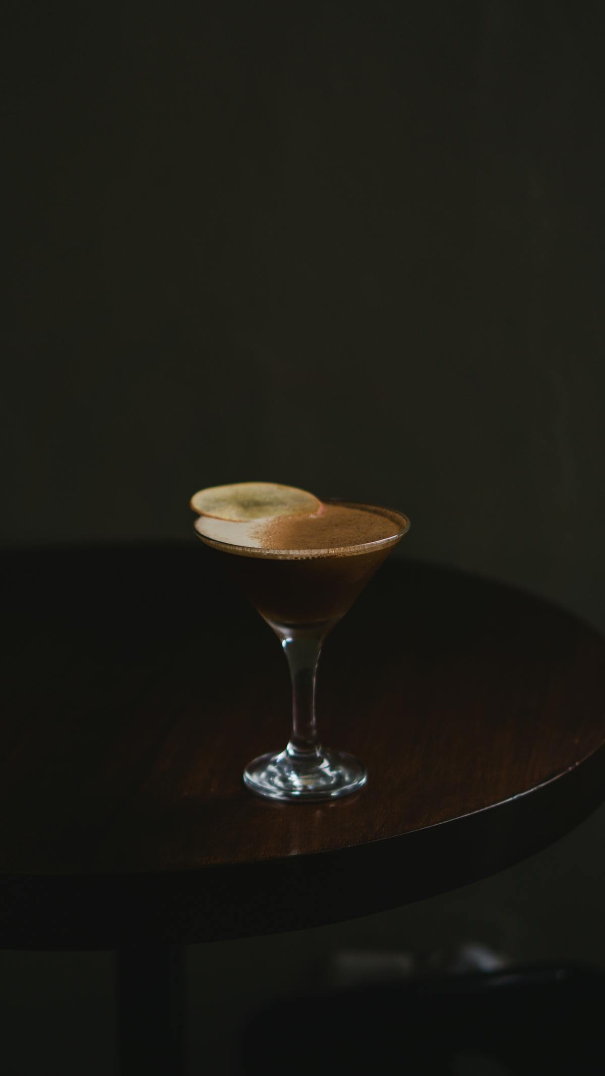 A perfectly crafted espresso martini with coffee bean garnish